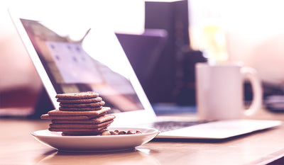 Cake beside macbook