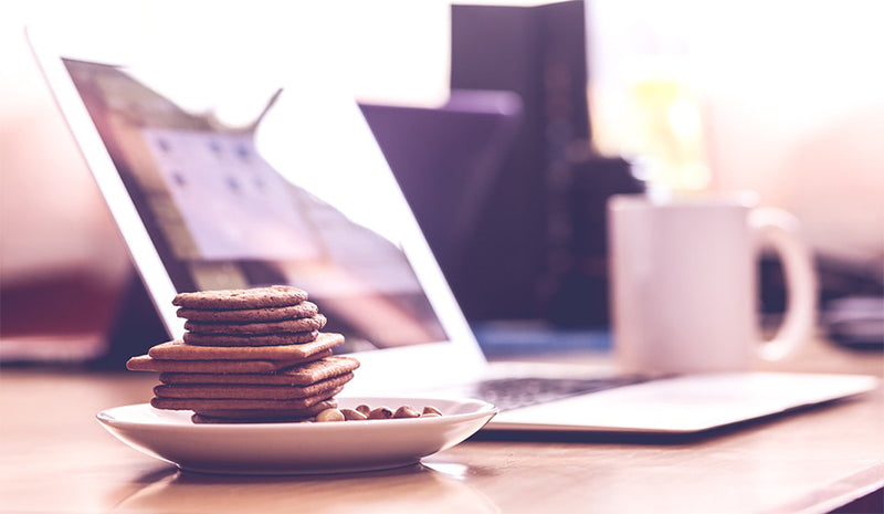 Cake beside macbook